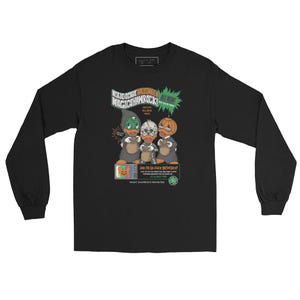 May include: Black long-sleeve t-shirt with a graphic of three cartoon ducks wearing Halloween costumes. The text on the shirt reads "Not So Scary Halloween Magic Shamrock" and "All New!"
