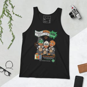 May include: Black tank top with a graphic of three cartoon ducks wearing Halloween costumes. The text on the graphic says "Not So Scary Halloween Magic Shamrock! All New!"