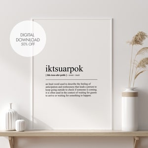 May include: A framed print with the word "iktsuarpok" in a minimalist design. The definition of the Inuit word is below the word. The print is displayed on a wooden shelf with decorative vases and dried plants. A digital download is 50% off.