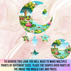 May include: A whimsical moon-shaped decoration featuring a smiling green frog on a lily pad, surrounded by flowers and a pond scene. Hanging below are star and diamond-shaped charms. The text "EXAMPLE" is visible. The background is a swirling pink and white pattern.