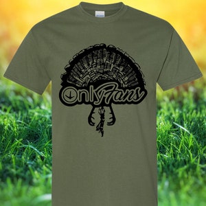 May include: A green t-shirt featuring a black graphic of a turkey with the text "Only Fans" underneath.