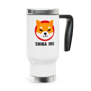 May include: White travel mug with a black handle and silver accents. The mug features a Shiba Inu dog graphic inside a red circle, with the words "SHIBA INU" printed below the graphic.