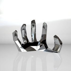 May include: A silver, geometric hand sculpture with a stylized design. The hand is open and the fingers are spread apart.