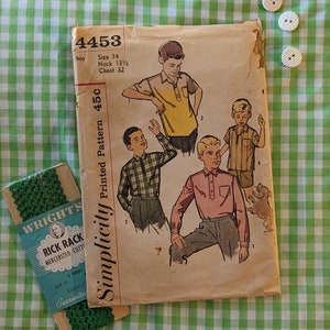 May include: Vintage Simplicity sewing pattern for a boy's shirt, pattern number 4453, size 14, printed on a tan background with illustrations of boys wearing the shirts.