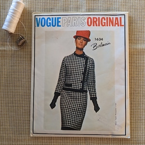 May include: Vogue Paris Original sewing pattern number 1634 for a black and white houndstooth dress and jacket by Balmain.