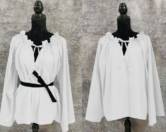 May include: White peasant blouse with long sleeves and a gathered neckline. The blouse has a black ribbon tied at the waist.
