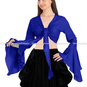 May include: A royal blue long-sleeved crop top with a tie front and bell sleeves. The top is made of a soft, flowing fabric and is perfect for dancing or layering.