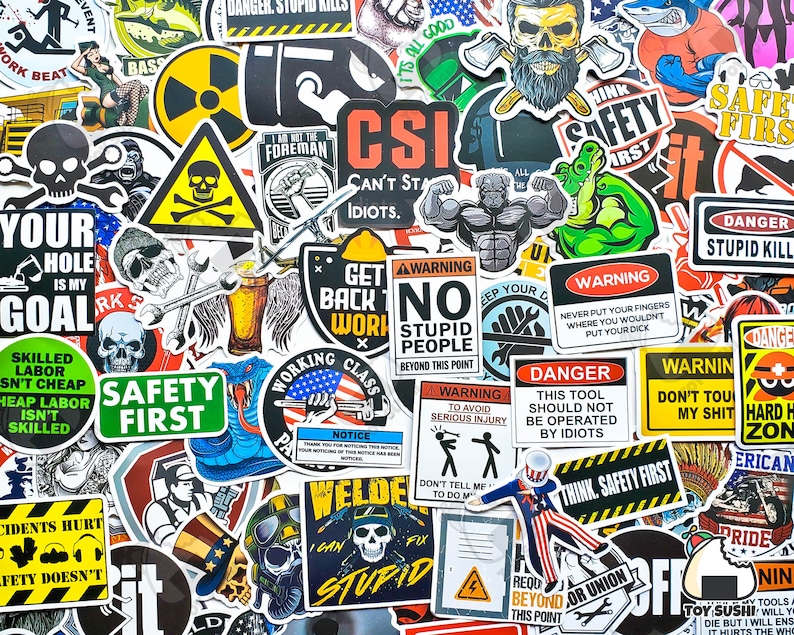 May include: A collection of colorful stickers with various designs and slogans. The stickers feature a variety of themes, including safety, work, and humor. Some of the slogans include "Safety First", "Think Safety First", "No Stupid People", "Danger", and "Get Back to Work".