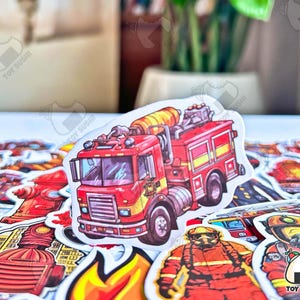 May include: A set of colorful stickers featuring a red fire truck, a firefighter, and other fire-themed designs. The stickers are printed with the text "Toy Sushi".