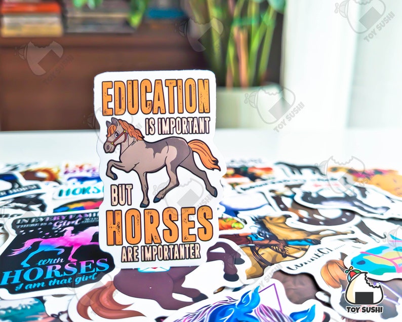 May include: A white sticker with a brown and orange horse illustration. The sticker reads "Education is important but horses are importanter."