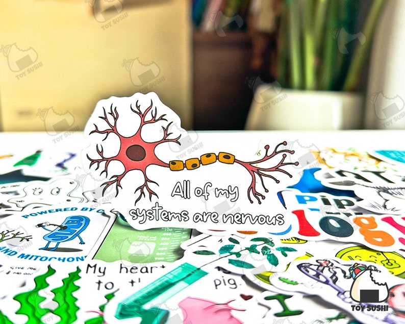 Puede incluir: Una pegatina con una ilustraci&oacute;n de neurona rosa y marr&oacute;n con el texto "All of my systems are nervous". Rodeada de otras pegatinas coloridas con varios dise&ntilde;os y textos.