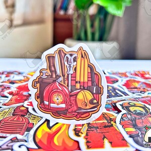 May include: A sheet of colorful firefighter themed stickers. The stickers feature a variety of images, including a fire truck, a fireman's helmet, and a fire hydrant. The stickers are perfect for adding a touch of fun to any project.