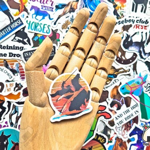 May include: A collection of horse-themed stickers, including a sticker with a silhouette of a rider on a horse against a sunset background.