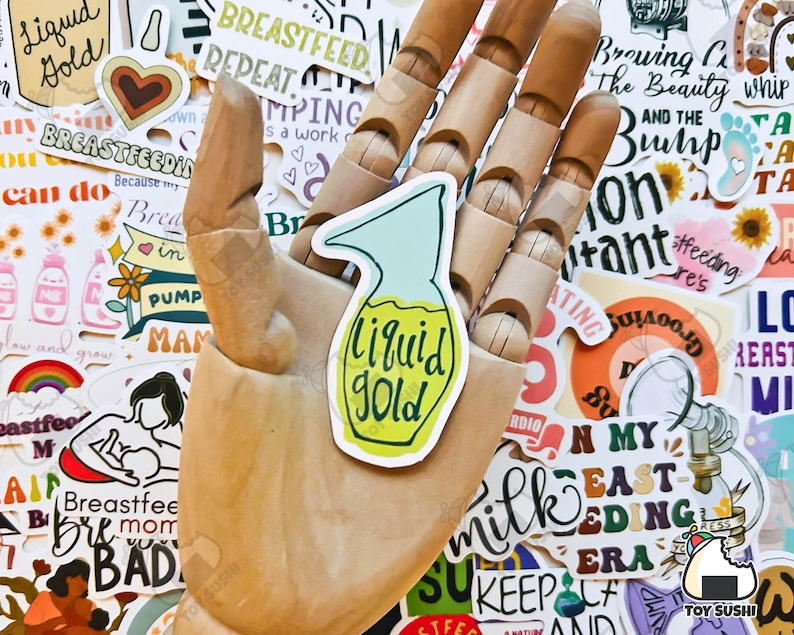 May include: A collection of colourful stickers with various designs and phrases related to breastfeeding. One sticker features a yellow and green illustration of a bottle with the text "Liquid Gold".