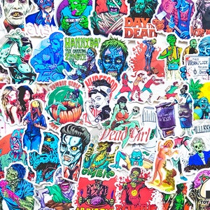 May include: A collection of colourful zombie-themed stickers. The stickers feature various zombie characters, including a zombie girl with a red dress, a zombie with a green brain, and a zombie with a red bandana. The stickers also feature text such as "Zombie Girls", "Day of the Dead", and "This Workplace Has Gone 0 Days".