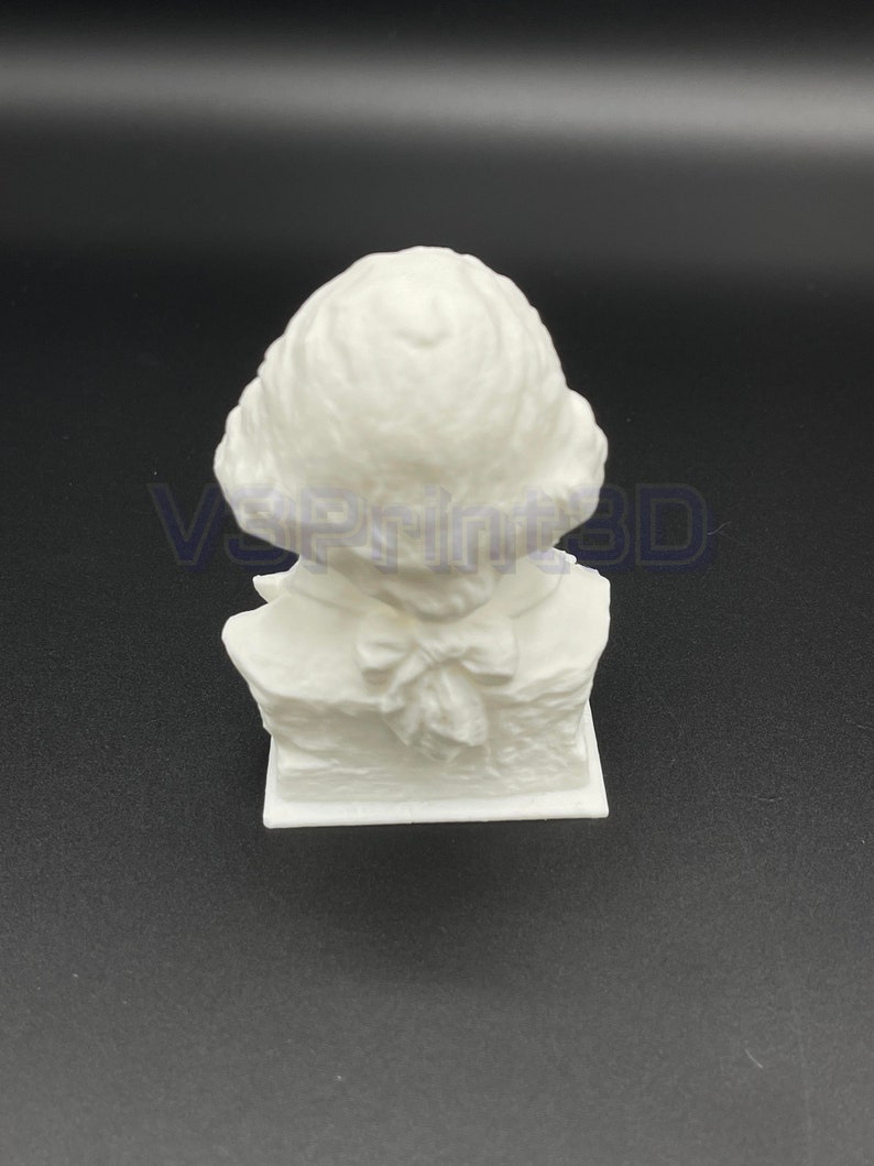 May include: White 3D printed bust sculpture of a person with a bow tie and a detailed hairstyle.