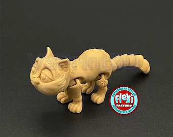May include: A tan-colored articulated cat figurine with a segmented tail. The figurine is posed in a walking position with its head tilted down. The figurine has a textured surface and is made of plastic. The figurine is sitting on a black surface. The image also includes a red and white sticker with the text "Authorized Seller Flexi Factory Authorized Seller".