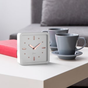 Driini Modern Desk and Table Analog Clock  (Rose Gold) - Battery Operated with Silent Sweep Movement – Small Square Desktop Decor