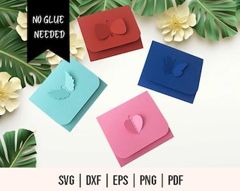 May include: Four different card templates with butterfly and heart cutouts. The cards are blue, pink, red, and light blue. The text "NO GLUE NEEDED" is visible in the top left corner of the image.