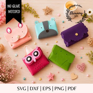 May include: Five small animal-themed pouches made of felt, including a pink mouse, a light blue bear, a purple scalloped pouch, a bright pink owl, and a green pouch. The text NO GLUE NEEDED and Dreaming SVG are visible. The pouches feature metal snaps.