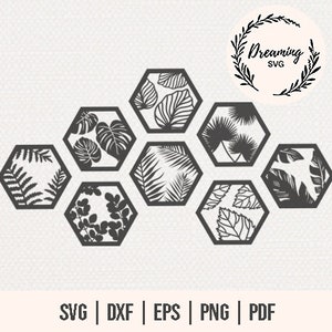 May include: Seven black, hexagonal wall art pieces, each with a unique leaf design. The pieces are arranged in a cluster. The image also includes the text "Dreaming SVG" within a circular frame and file type options.