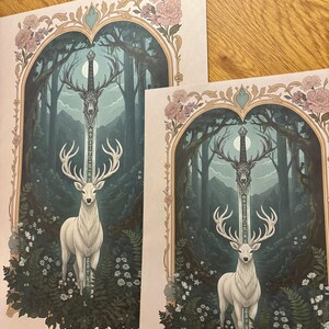 May include: Two art prints featuring a white stag with large antlers, standing in a forest scene. A sword with deer antlers is in the center. The prints are framed with floral and ornate designs, with a color palette of greens, blues, and pinks.