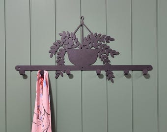 Perchero de pared de metal: decoración moderna para el hogar con ganchos elegantes