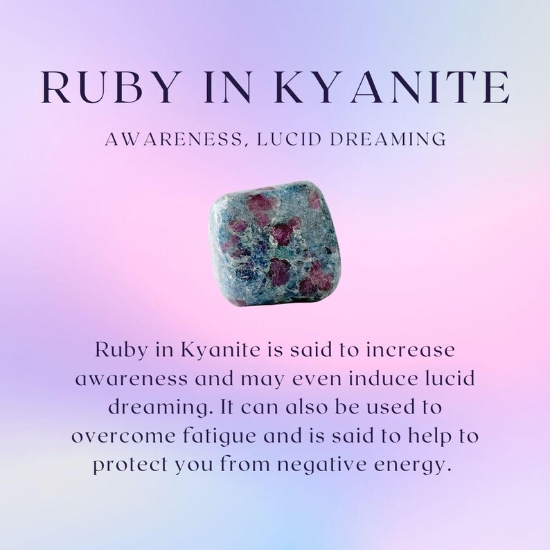 May include: A polished, tumbled stone of ruby in kyanite featuring deep red inclusions within a blue-grey matrix. The text reads: RUBY IN KYANITE, AWARENESS, LUCID DREAMING. Ruby in Kyanite is said to increase awareness and may even induce lucid dreaming.