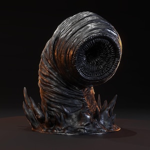 May include: A dark, textured, worm-like creature figurine with a prominent circular mouth lined with numerous small, sharp teeth. The body is segmented and curved, rising from a base surrounded by several pointed, jagged, dark protrusions.