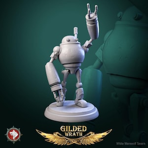 May include: A gray robot figurine with a round head and articulated limbs, posed with one arm raised in a rock-and-roll gesture. The figurine stands on a circular base, with the words "GILDED WRATH" and a logo at the bottom.