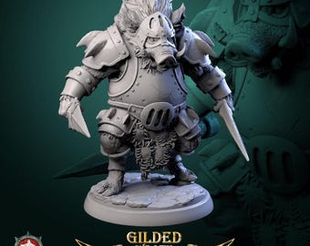 May include: A gray resin miniature figure of an anthropomorphic boar warrior wearing plate armor and a helmet, holding a sharp blade in each hand. The figure stands on a circular stone base. Text at the bottom reads GILDED WRATH.