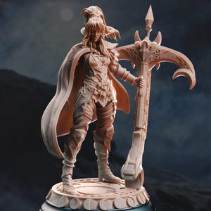 May include: A peach-colored resin miniature figurine of a warrior standing on a circular base. The figure wears detailed armor, a flowing cape, and holds a large, ornate crossbow. The character has long hair tied back and stands in a poised stance.