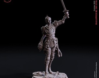 May include: A grey miniature figurine of a warrior standing on a 25 mm base, wearing detailed plate armor and chainmail. The figure holds a sword raised high in one hand and a helmet in the other, with a dagger lying on the textured ground base.