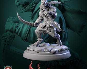 May include: A light gray miniature figurine of a reptilian humanoid warrior standing on a rocky base. The figure wears a hooded cloak, a belt with pouches, and holds two curved blades. The text Monstrocifice is visible in red at the bottom.