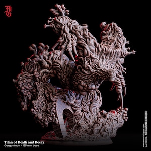 Peut inclure: Une figurine en résine brun foncé très détaillée intitulée Titan of Death and Decay, représentant une masse organique tourbillonnante de membres, de crânes et une arche en pierre. La figurine repose sur une base de 125 mm avec un bâtiment intégré.