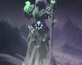 May include: A grey, textured fantasy figurine of a reptilian humanoid figure wearing ornate armor and a long robe. The figure holds a glowing green flame in one hand and a tall, intricate staff topped with a glowing green orb in the other.