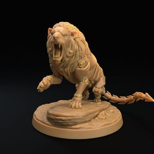May include: A beige unpainted miniature figurine of a lion with a segmented, armored tail and mechanical-looking shoulder plating. The lion is captured in a dynamic, roaring pose with its mouth wide open, standing on a textured circular base.