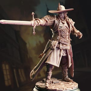May include: A light-colored miniature figurine of a warrior wearing a wide-brimmed hat, ornate chest armor, and layered robes. The figure stands on a stone-textured base, holding a long sword extended forward with a detailed hilt and crossguard.