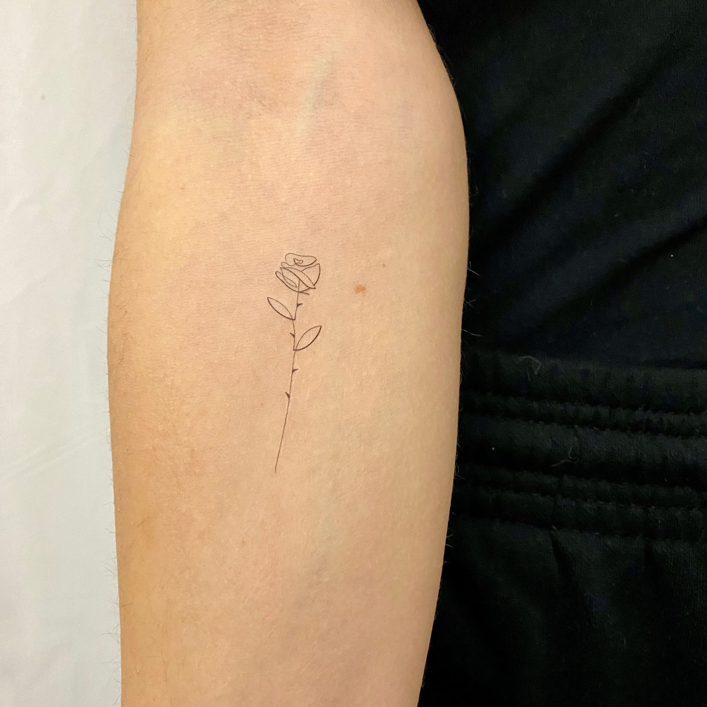 Minimalist Rose Tattoo That Speaks Volumes