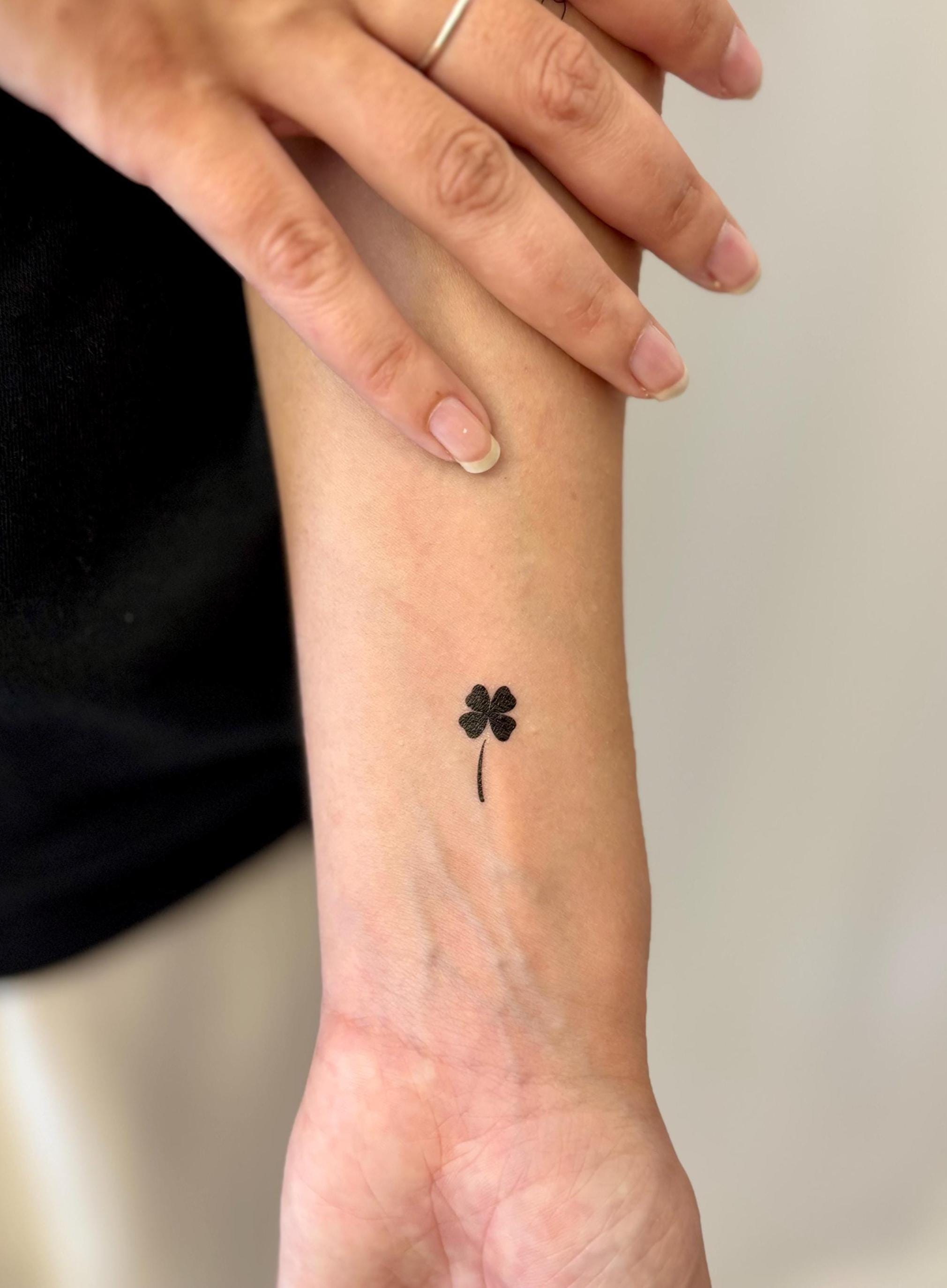 Small Black Four Leaf Clover Tattoo Idea