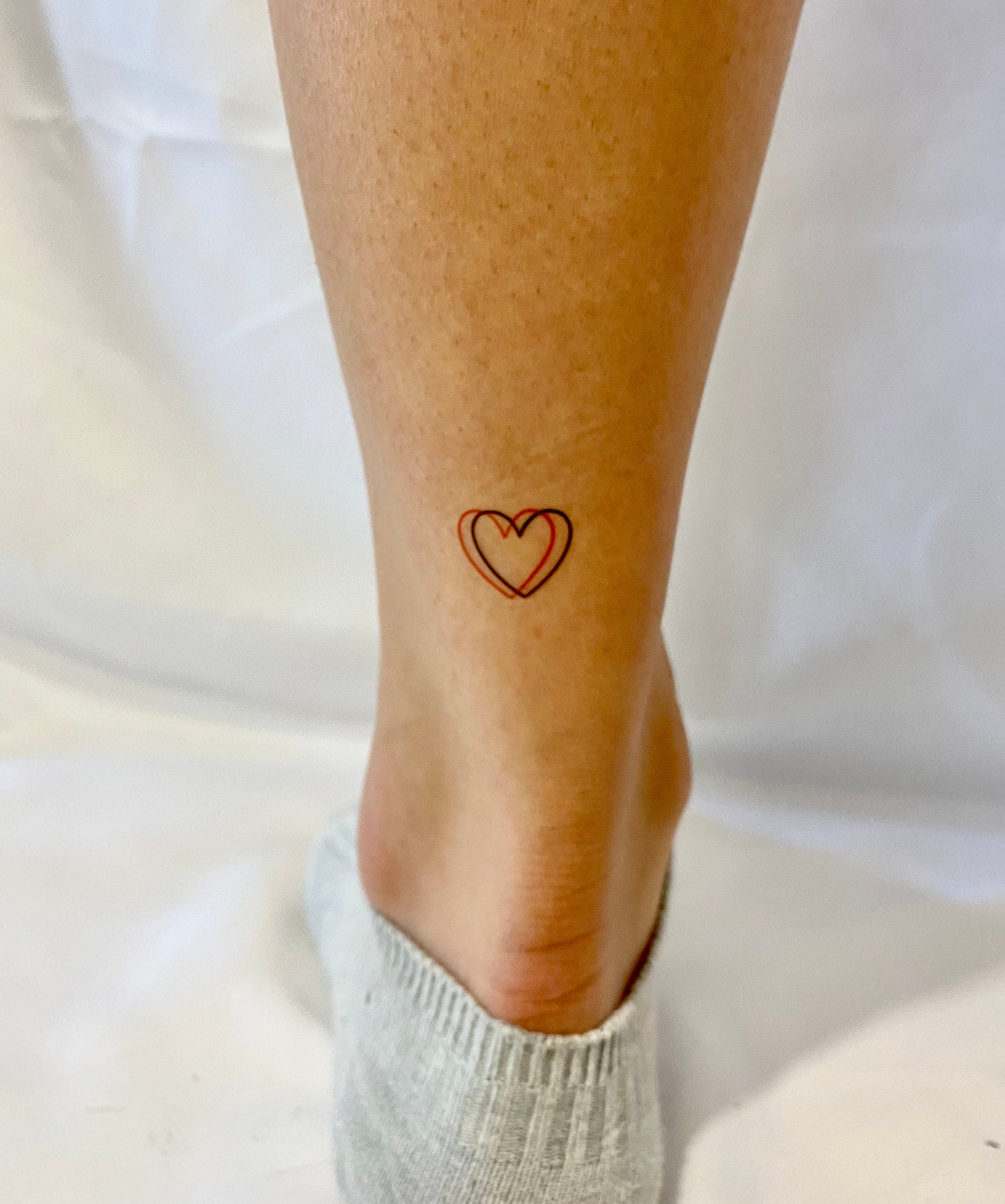 Awesome Black And Red Heart Tattoo On Side
