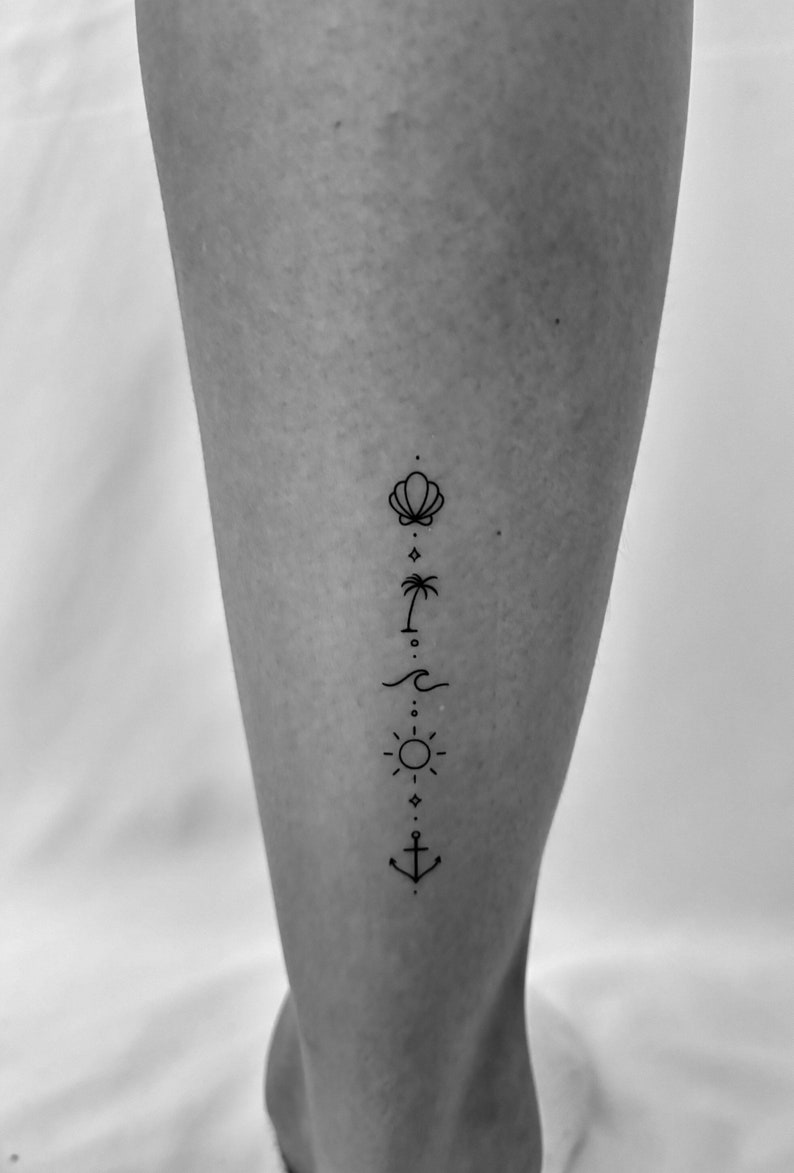 May include: A black and white line art tattoo design on a person's leg. The design features a seashell, palm tree, wave, sun, and anchor.
