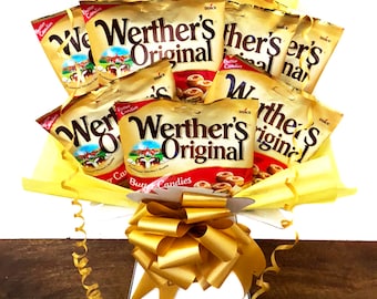 May include: A bouquet of Werther's Original Butter Candies wrapped in yellow tissue paper and tied with a gold ribbon. The bouquet is in a white box with a gold ribbon.