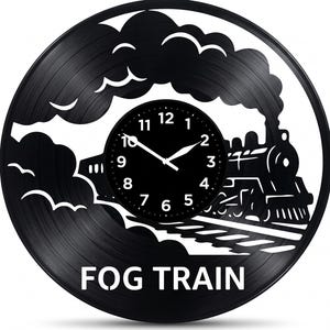 May include: Black vinyl record clock featuring a train design with the words "FOG TRAIN". The clock face is black with white numbers and hands. The train is depicted with smoke and clouds.