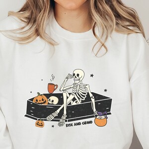 Rise and Grind Skeleton Sweatshirt: Spooky Season Crewneck