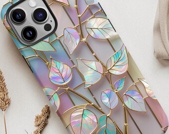 May include: A phone case with a stained-glass design featuring iridescent leaves and gold-colored stems. The case has a soft pastel color palette of pink, blue, and green. The phone case is designed to fit a smartphone.