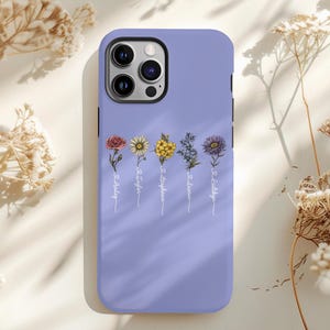 May include: A lavender phone case with a floral design and the text "To Holly", "To Taylor", "To Daphne", "To Lauren", and "To Bailey".