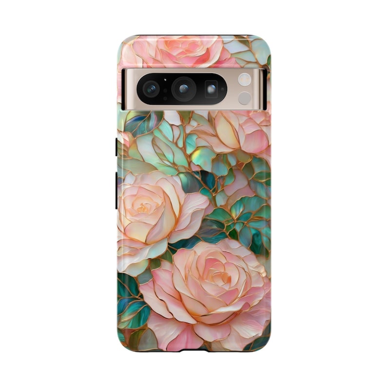 May include: A phone case with a floral design. The case features pink roses with gold accents on a green and blue background.