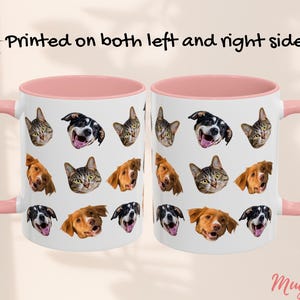 May include: Two white ceramic mugs with pink rims and handles. The mugs feature a repeating pattern of dog and cat faces. The text "Printed on both left and right side" is printed above the mugs.