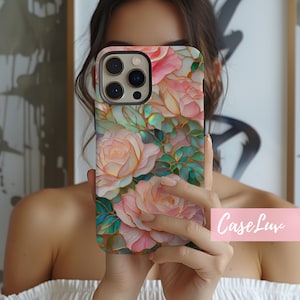 May include: A phone case featuring a floral design with pink roses, green leaves, and gold accents. The case has a glossy finish and a protective bumper. The text "CaseLuv" is visible on the bottom right.